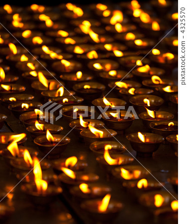 Burning candles in Buddhist temple. McLeod Ganj, Himachal Prades 4325570