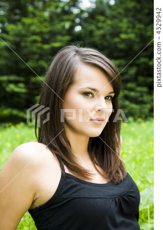 Pretty girl laying on the meadow 4329942