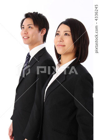 A smiley man and woman staring at a distance in a suit A smiley man and woman staring at a distance in a suit 4336245