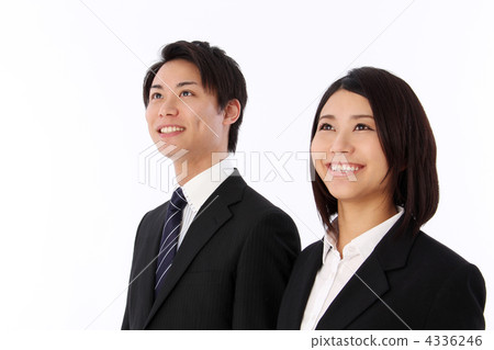 A smiley man and woman staring at a distance in a suit A smiley man and woman staring at a distance in a suit 4336246