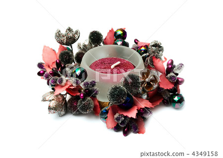 Decorative candle in an environment of a wreath 4349158