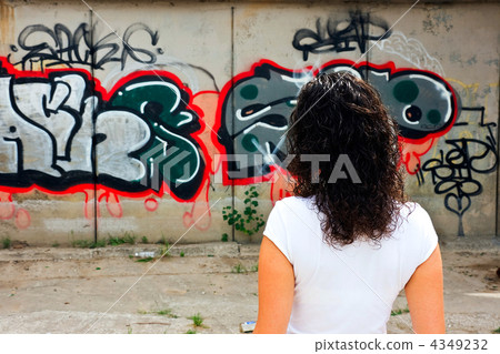 The beautiful girl against graffiti. The beautiful girl against graffiti. 4349232