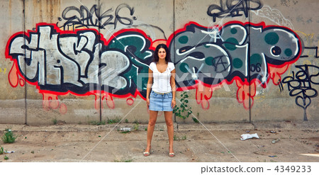 The beautiful girl against graffiti. The beautiful girl against graffiti. 4349233