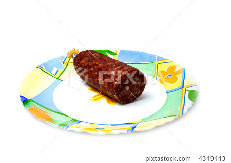 Salami piece on a plate. Isolated on a white  4349443