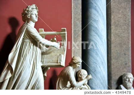 Sculpture of the woman with a musical instrument. Sculpture of the woman with a musical instrument. 4349478