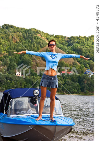 Happy young woman standing at the boat Happy young woman standing at the boat 4349572