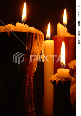 Burning candles isolated on black background Burning candles isolated on black background 4350959