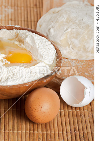 Bakery ingredient. Flour, raw eggs and dough for making bread 4351095