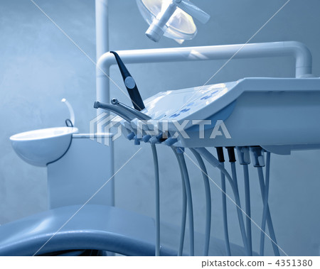 Dental tools on a dentist's chair with shallow depth of field bl Dental tools on a dentist's chair with shallow depth of field bl 4351380