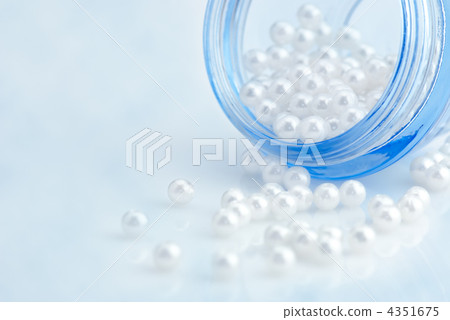 Cosmetic cream container with natural pearls over blue sky imita Cosmetic cream container with natural pearls over blue sky imita 4351675