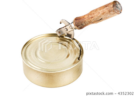 Old dirty tin can opener with wooden handle opening tin can with Old dirty tin can opener with wooden handle opening tin can with 4352302