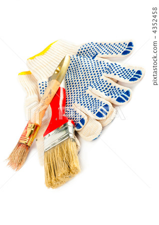 Painter working tools. Paintbrushes and gloves. 4352458