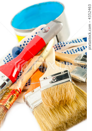 Painter working tools. Paint bucket with blue paint, gloves and 4352463