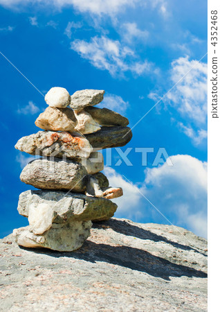 Two stone towers. Stack of meditation zen stones over blue sky 4352468