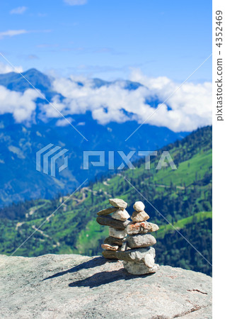 Stone towers. Two pyramid of meditation zen stones on mountains Stone towers. Two pyramid of meditation zen stones on mountains 4352469