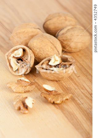 Walnuts on the wooden background 4352749