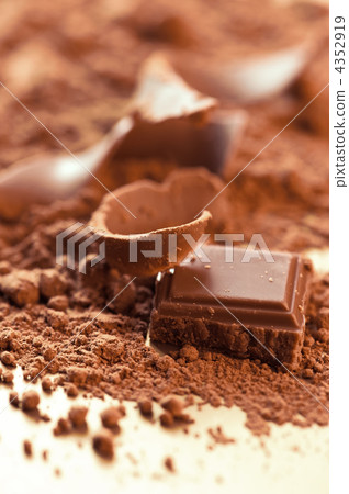 Chocolate background. Bars and strips of chocolate with cocoa po 4352919