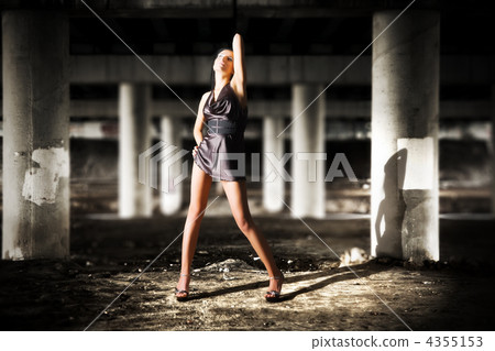 Sexy woman posing in dark industrial zone 4355153