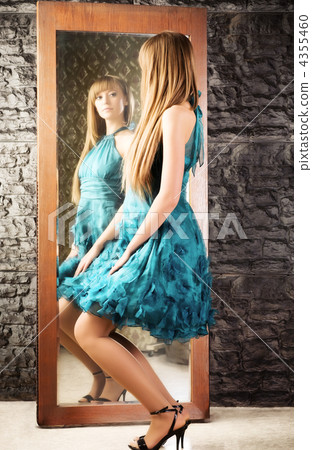Coquet woman in front of the mirror 4355460
