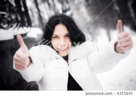 Happy woman showing excellent handsign 4355645