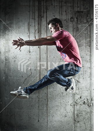 Young man dancer jumping 4356575