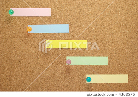 Multiple sticky notes fastened with cork board and thumbtack Multiple sticky notes fastened with cork board and thumbtack 4368576