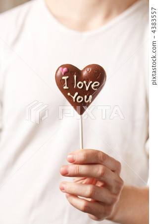 man with chocolate heart in the hands man with chocolate heart in the hands 4383557