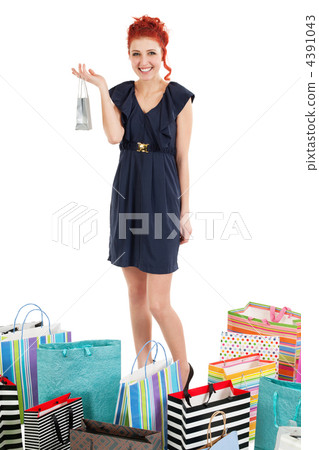 Redhead standing with shopping bags 4391043