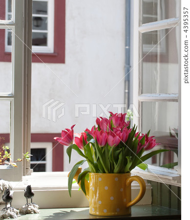 bouquet of tulips on the windowsill 4395357