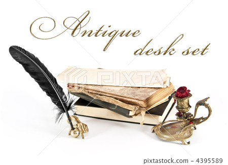 Antique desk set and books on a white background. Antique desk set and books on a white background. 4395589