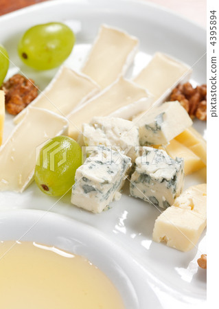 Cheese plate with grapes and honey Cheese plate with grapes and honey 4395894