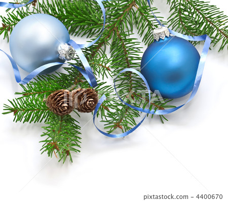 Pine branch with pine cones and Christmas decorations on a white background. Pine branch with pine cones and Christmas decorations on a white background. 4400670