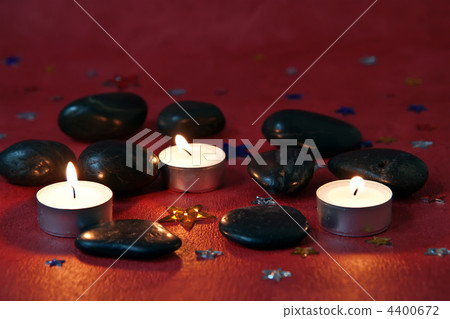 lighted candles on a red background lighted candles on a red background 4400672