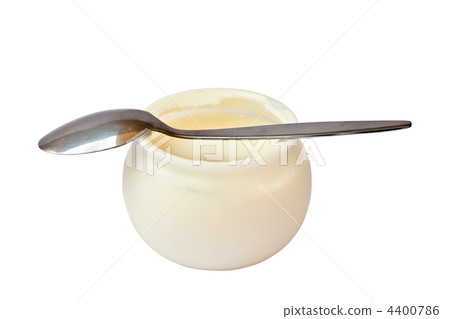 Yogurt in a jar with a spoon. 4400786