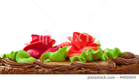 Chocolate cake with two cream-colored roses. Isolated on white background. Chocolate cake with two cream-colored roses. Isolated on white background. 4400804
