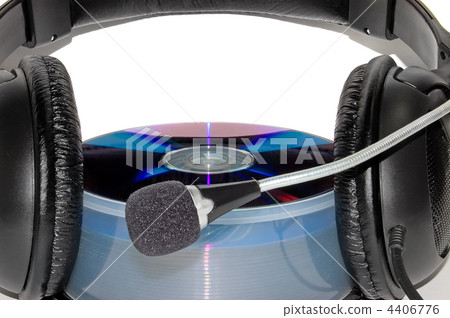 Earphones on to of a CD 4406776