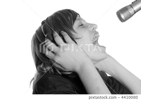 teenager in ear-phones teenager in ear-phones 4410080