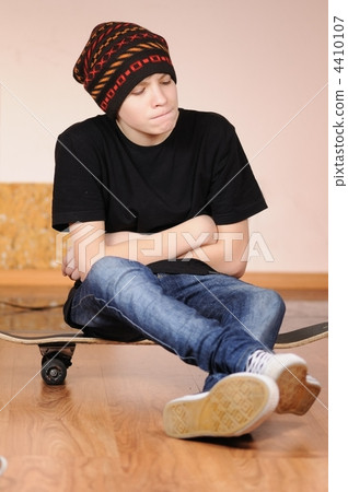 The teenager with a skateboard The teenager with a skateboard 4410107
