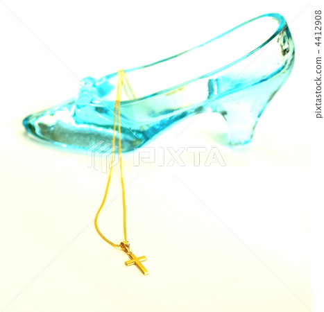 Gold pendant and glass shoes, interior, indoor, white background 4412908