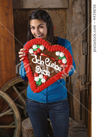 Eating a huge heart cookie 4439656