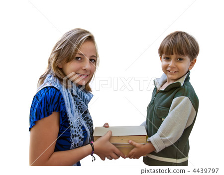 A young girl pass the book a little boy. A young girl pass the book a little boy. 4439797