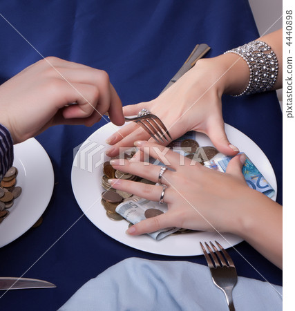 hand with a fork for the money runs hand with a fork for the money runs 4440898
