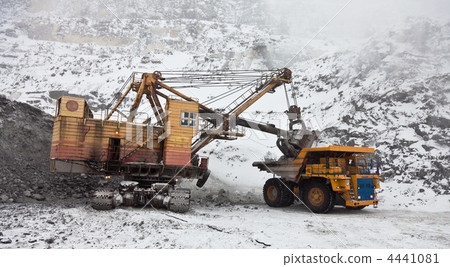 Dump truck loaded with an excavator Dump truck loaded with an excavator 4441081