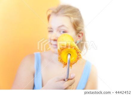 Happy young woman painting wall / Color your life / focus on the Happy young woman painting wall / Color your life / focus on the 4442452