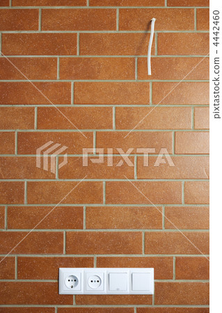 power outlets on the brick wall / vertical / photo power outlets on the brick wall / vertical / photo 4442460
