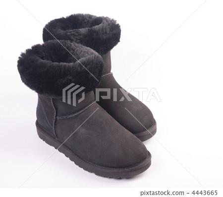 Winter fur boots over white background 4443665