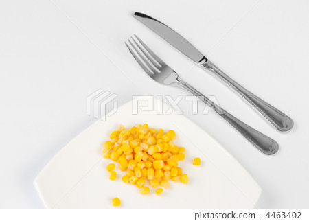 Place setting for one person and handful of Indian corn. 4463402