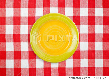 yellow plate on red checked tablecloth yellow plate on red checked tablecloth 4464124