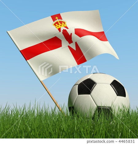 Soccer ball in the grass and flag of Northern Ireland. 4465831