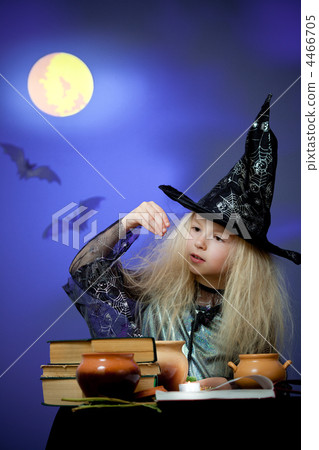 Girl dressed up as witch in night making magic 4466705